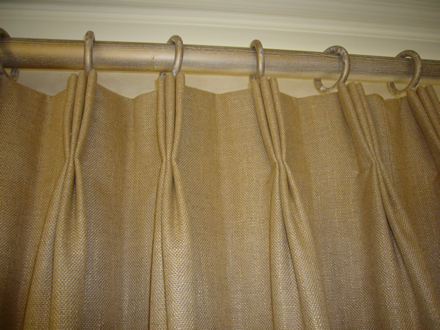 Curtain rail and pleated curtains